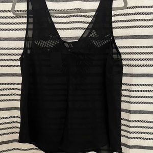 Embroidered, sheer black tank.